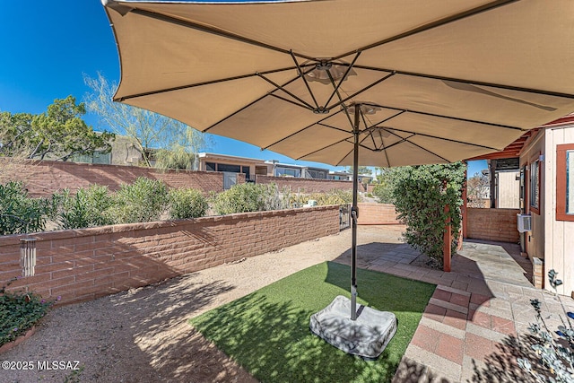 view of yard with cooling unit and a patio area