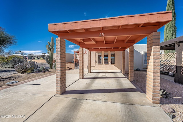 view of patio / terrace with a carport