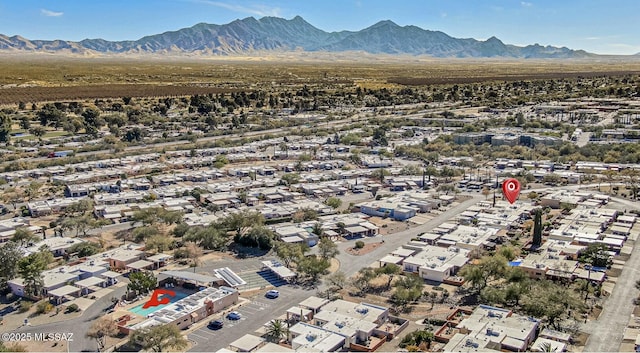 birds eye view of property with a mountain view