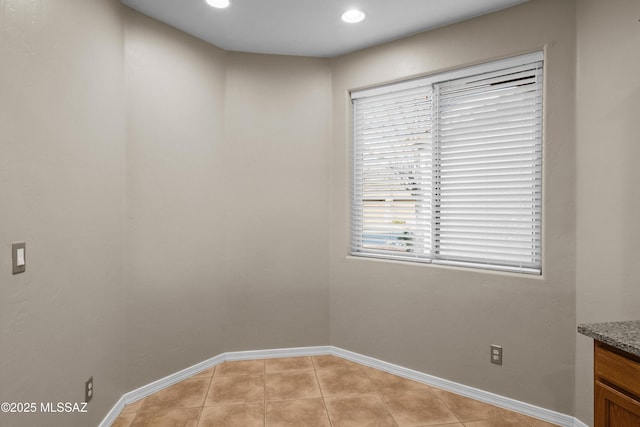 spare room with light tile patterned floors