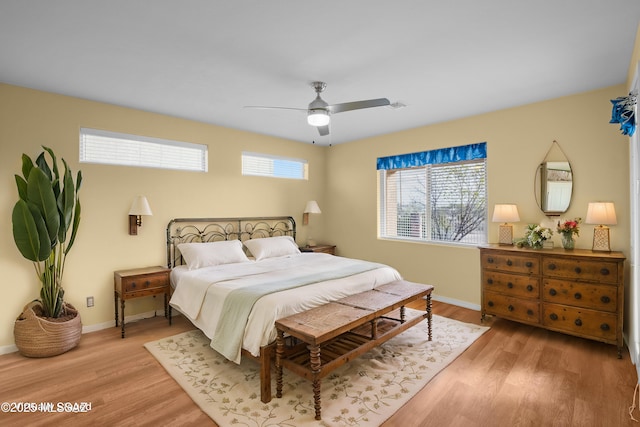 bedroom featuring ceiling fan and light hardwood / wood-style flooring