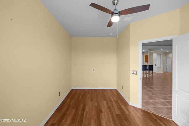 unfurnished room featuring ceiling fan and hardwood / wood-style flooring