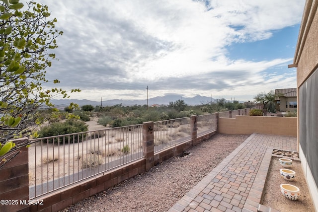 view of patio / terrace featuring a mountain view