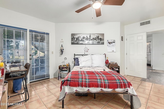 tiled bedroom featuring access to exterior, visible vents, and ceiling fan