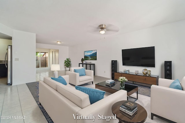 tiled living room with ceiling fan