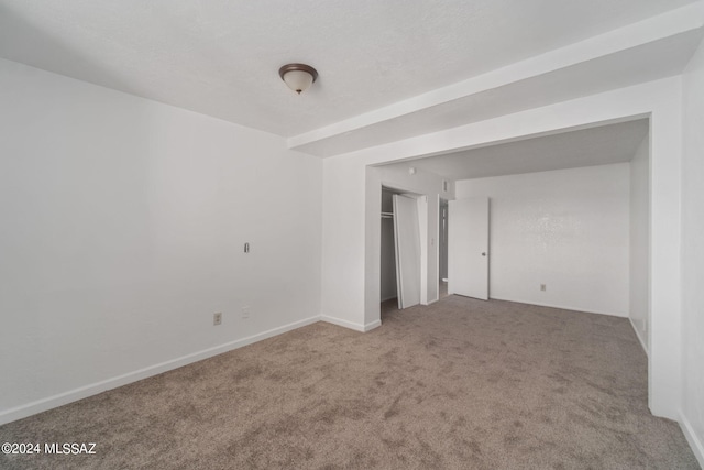 unfurnished room featuring carpet