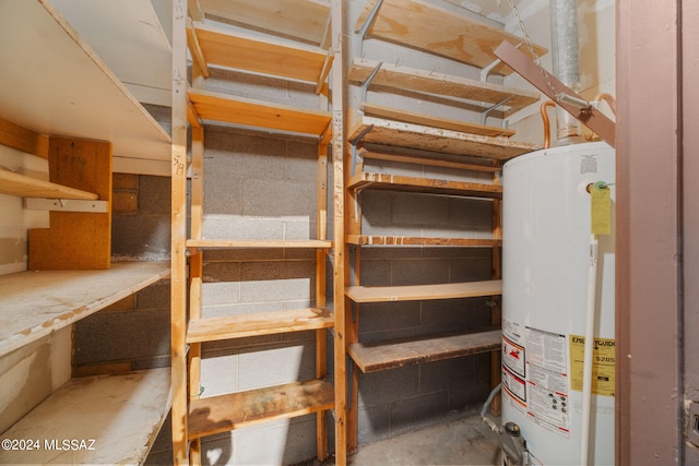 storage room featuring water heater