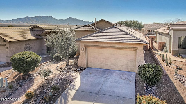 view of front of home featuring a mountain view and a garage