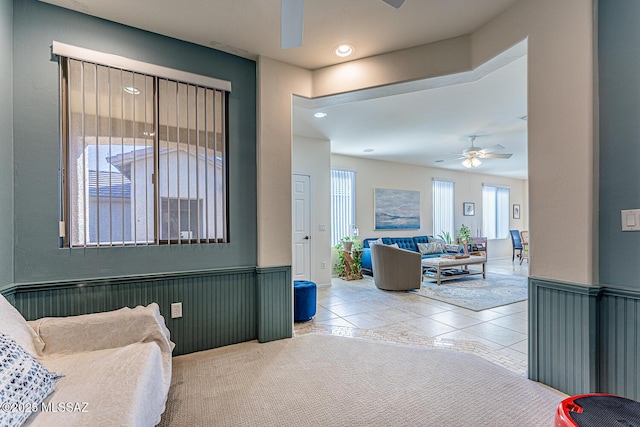 interior space featuring ceiling fan and light tile patterned floors