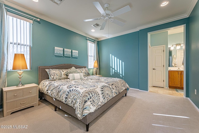 carpeted bedroom featuring connected bathroom, ceiling fan, and crown molding