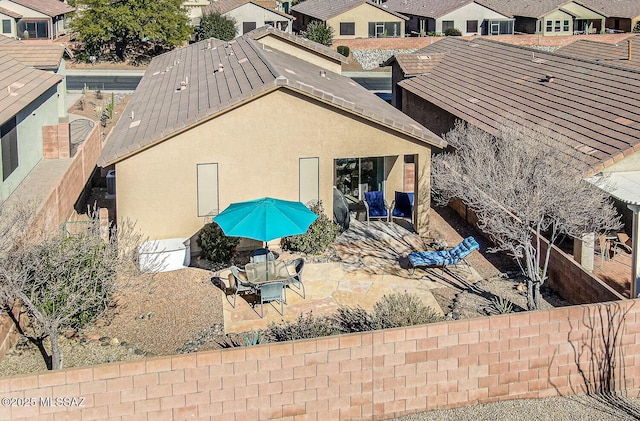 back of house with a patio area