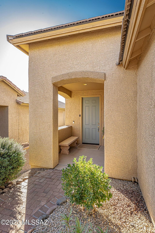 doorway to property with a patio