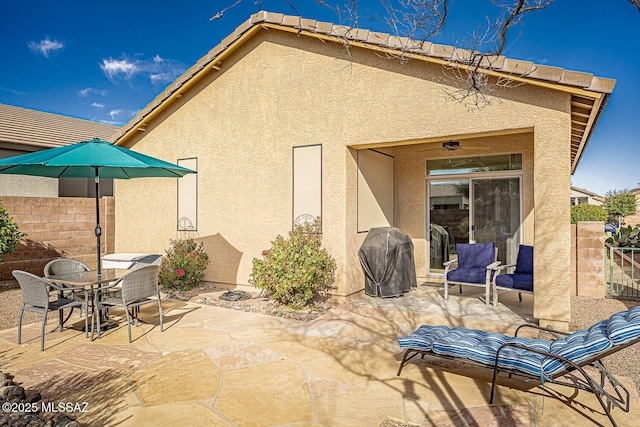 view of patio featuring a grill