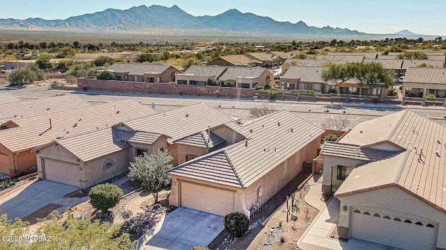 birds eye view of property with a mountain view