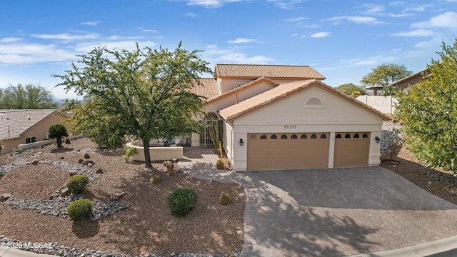 view of front of home with a garage