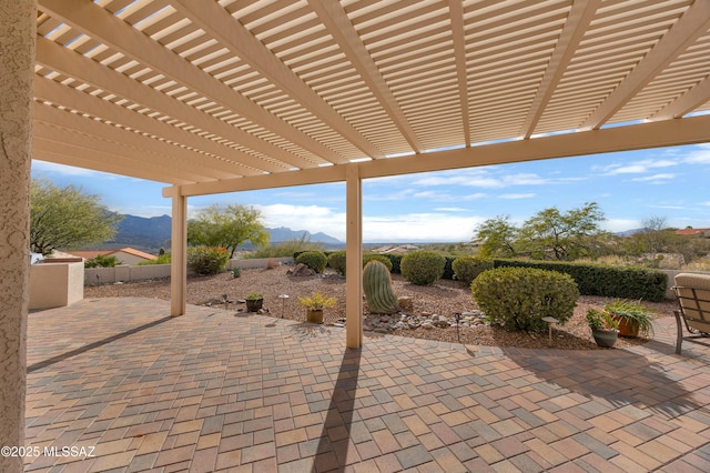 view of patio featuring a mountain view and a pergola