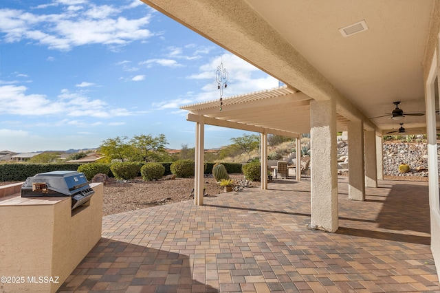 view of patio / terrace with ceiling fan, an outdoor kitchen, a pergola, and a grill