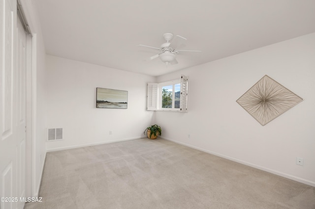 unfurnished room with light carpet and ceiling fan