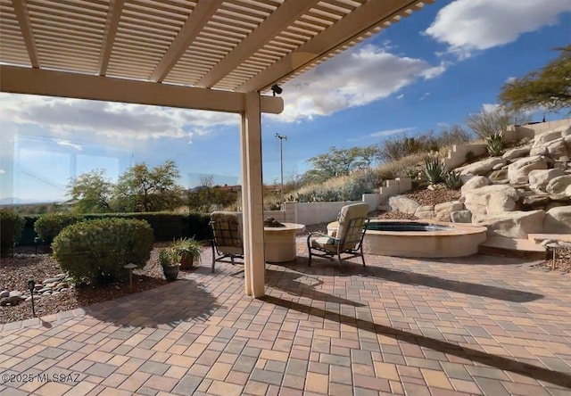 view of patio with a pergola and an outdoor hot tub