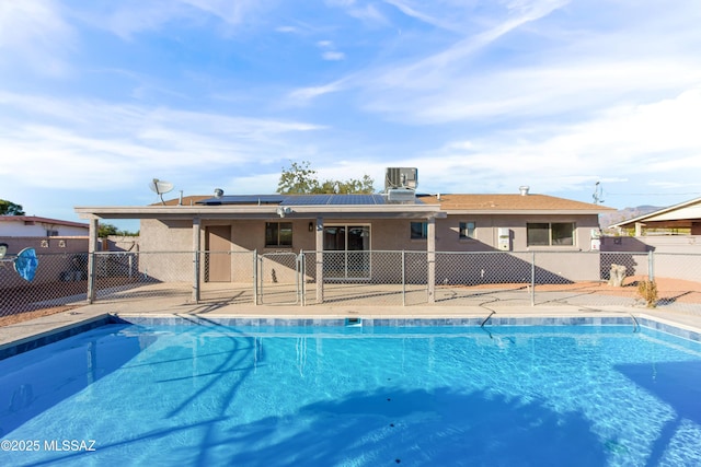 view of pool featuring central air condition unit