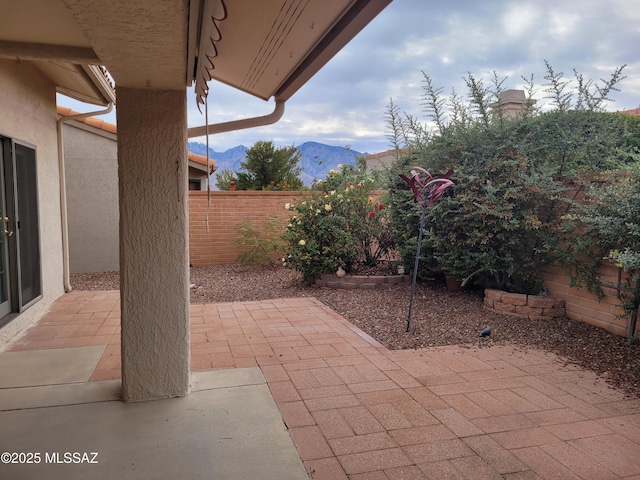 view of patio / terrace featuring a mountain view