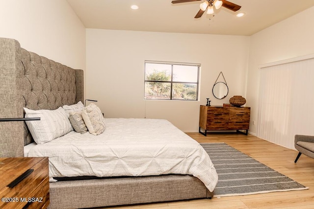 bedroom featuring ceiling fan and hardwood / wood-style flooring