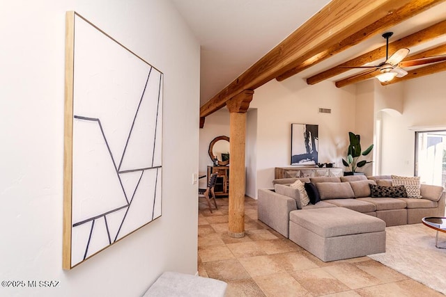 living room featuring ceiling fan and beam ceiling