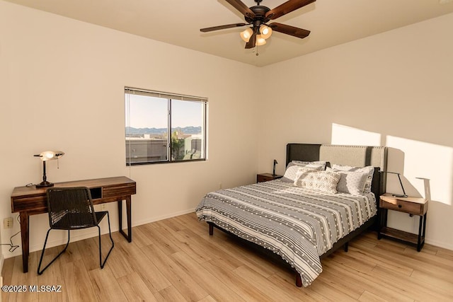 bedroom featuring ceiling fan and light hardwood / wood-style floors