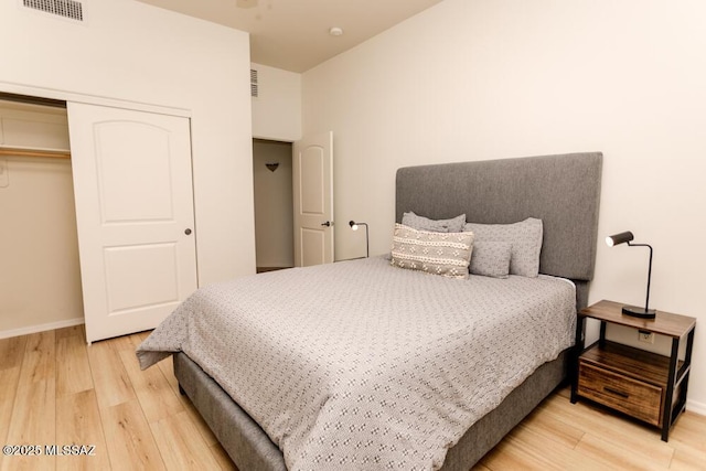 bedroom featuring a closet and hardwood / wood-style flooring