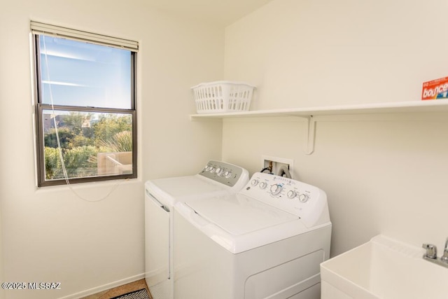 laundry area with sink and separate washer and dryer