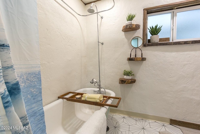 bathroom with shower / bath combo