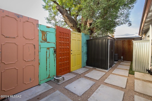 view of gate featuring central AC unit