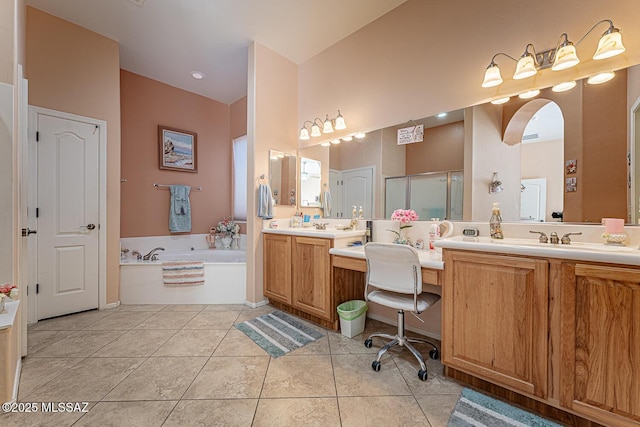 bathroom with tile patterned flooring, vanity, and shower with separate bathtub