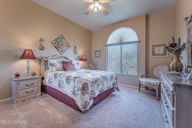 carpeted bedroom featuring ceiling fan and lofted ceiling