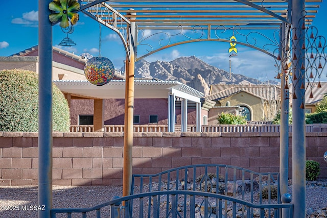 view of gate with a mountain view