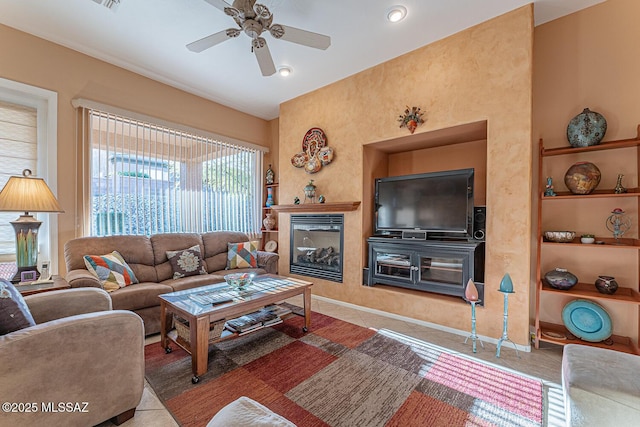 living room featuring tile patterned floors and ceiling fan