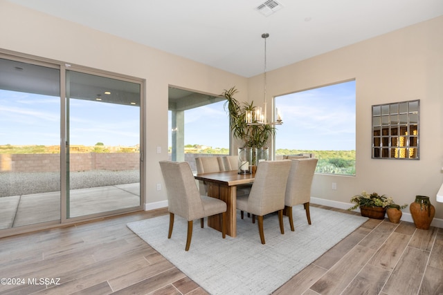 dining area with a notable chandelier