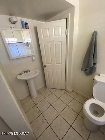 bathroom with tile patterned floors and toilet