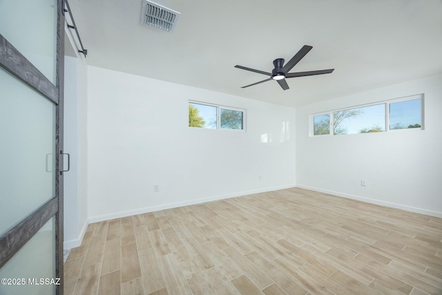 unfurnished room with ceiling fan and light hardwood / wood-style flooring