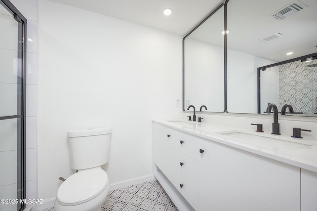 bathroom with vanity, toilet, and walk in shower