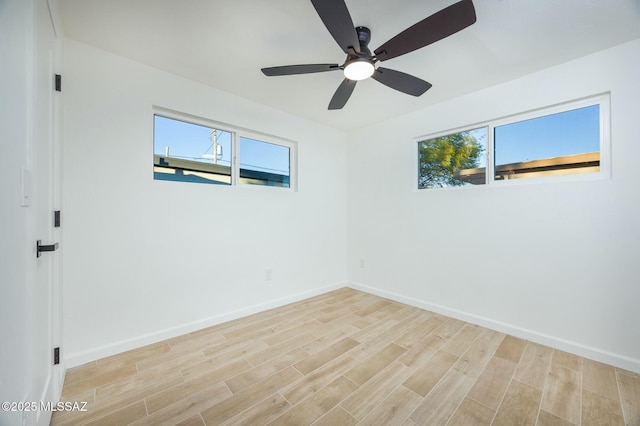 unfurnished room with ceiling fan