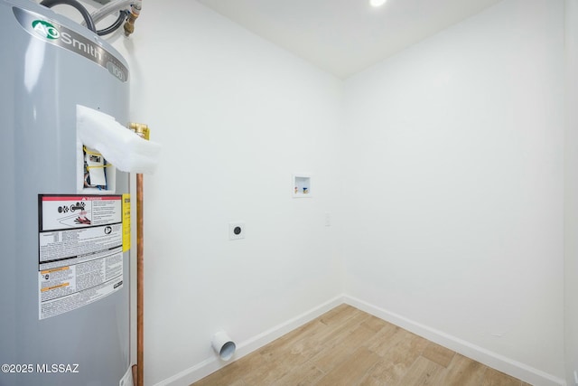 laundry room featuring washer hookup, electric dryer hookup, hardwood / wood-style floors, and water heater