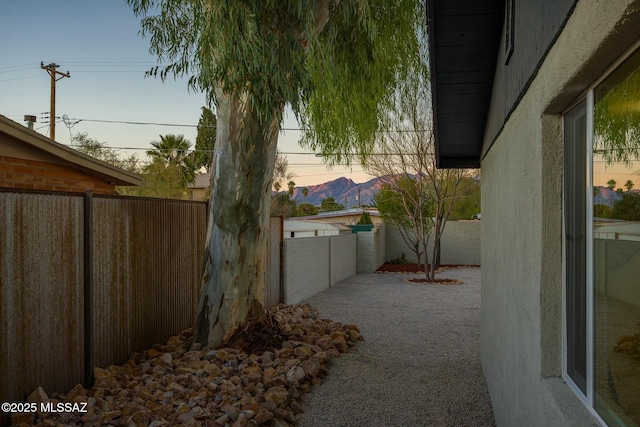 yard at dusk with a patio