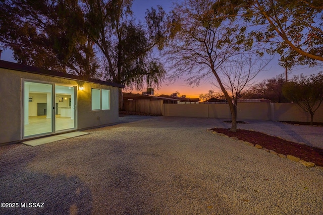 view of yard at dusk