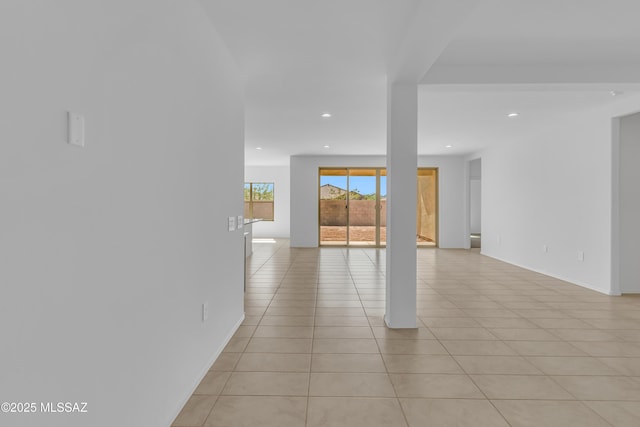 empty room with light tile patterned floors