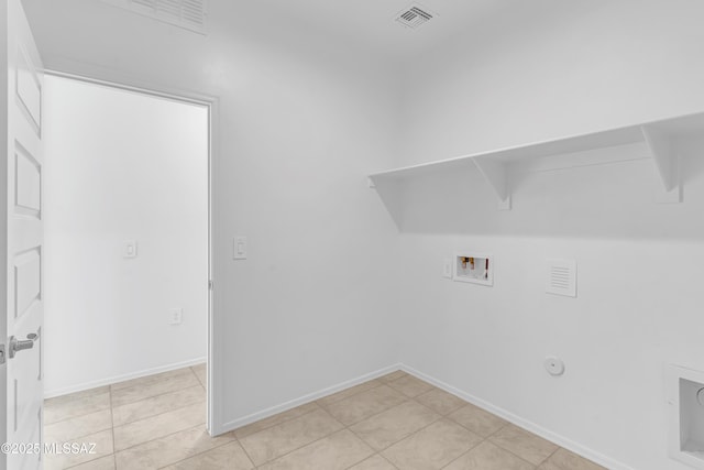 washroom with washer hookup, light tile patterned floors, and hookup for a gas dryer