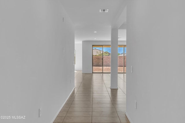 hallway with light tile patterned floors