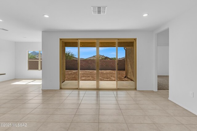 unfurnished room featuring light tile patterned flooring