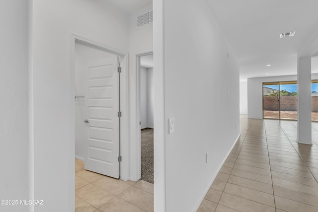 hallway with light tile patterned floors