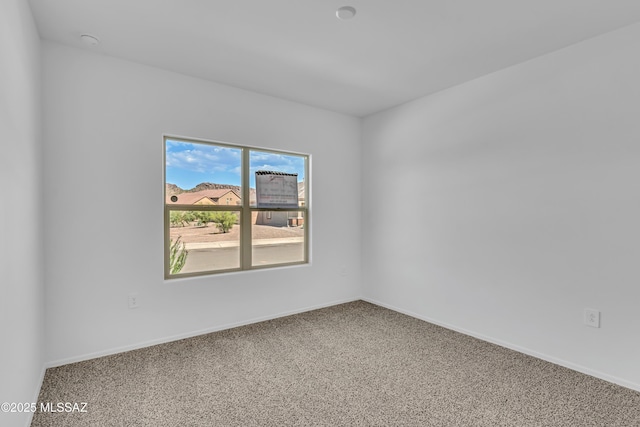 unfurnished room with carpet floors